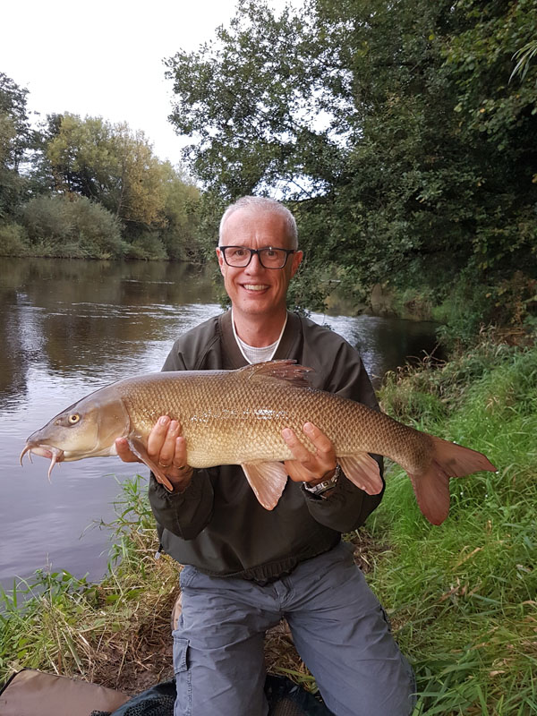 Colin and a 9lbs 13oz barbel